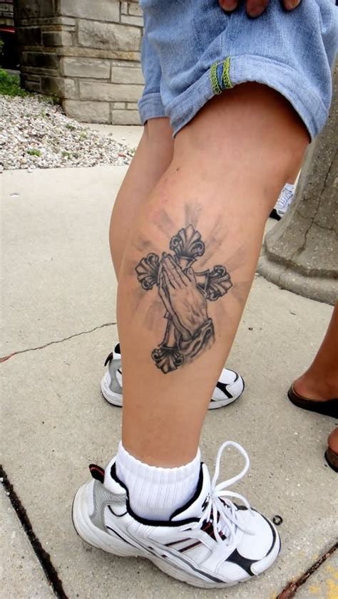 cross on calf tattoo